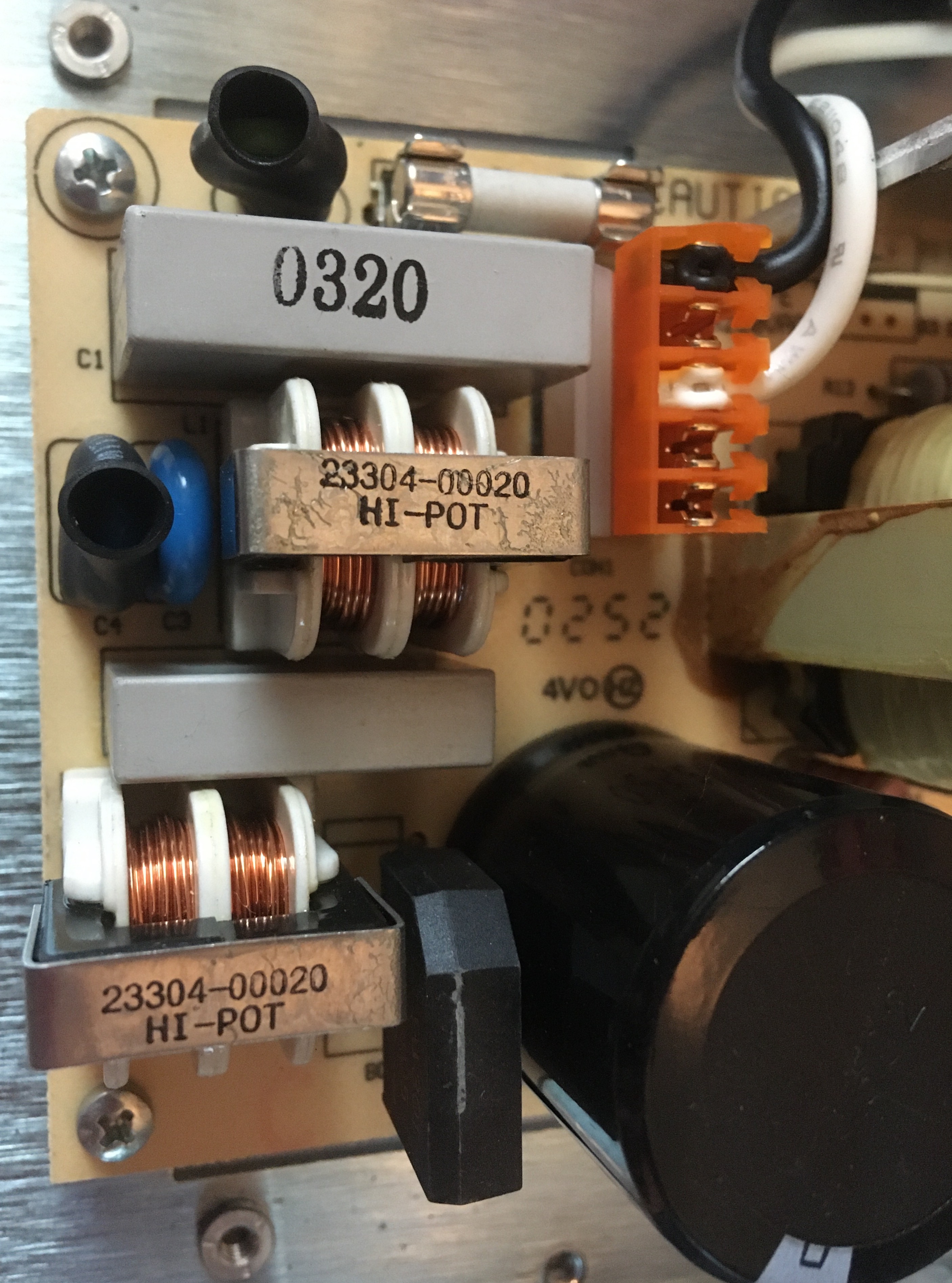 Two Sets of Copper Coils with Axis Parallel to Board Bracketed by White Plastic