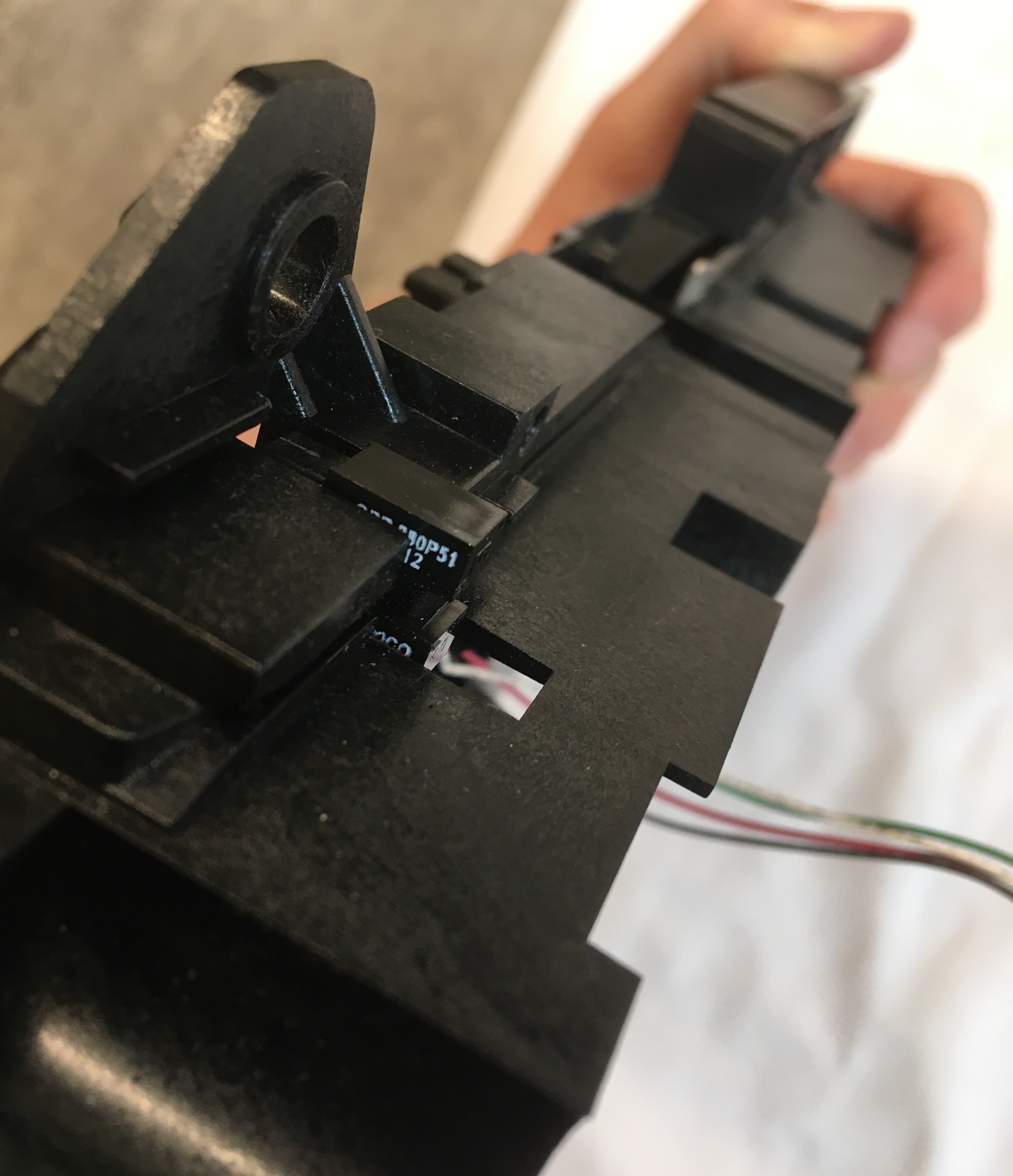 Small Black Sensor Tucked in Card Roller Route