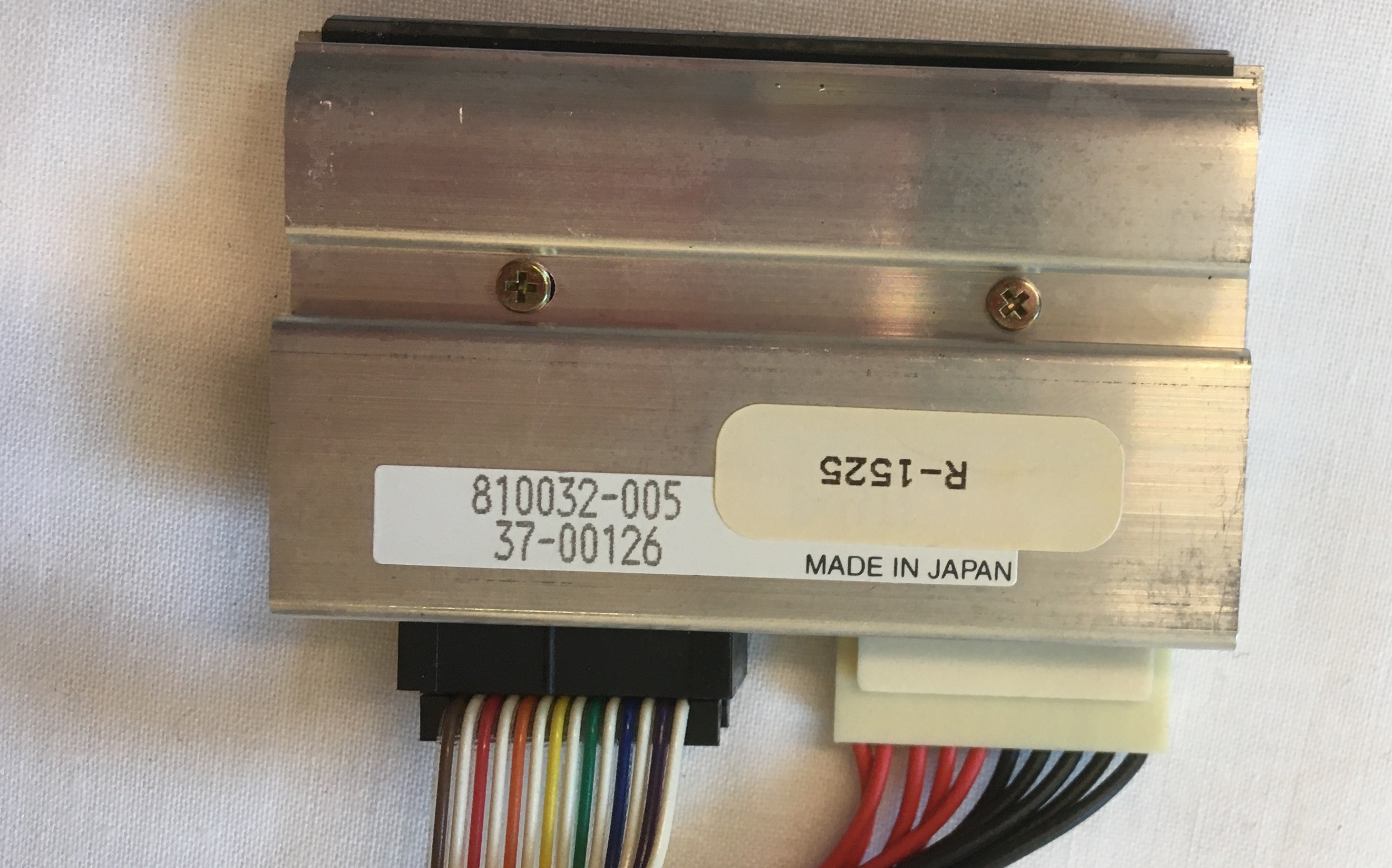 Metal Plate Piece with Many Wires Leading In and Labelled 'R-1525'