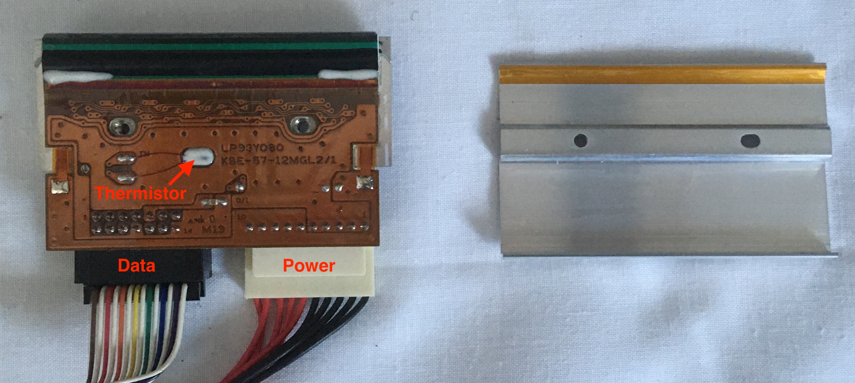 Metal Cover Removed from Heating Element Revealing Copper Tone PCB with Traces and Vias