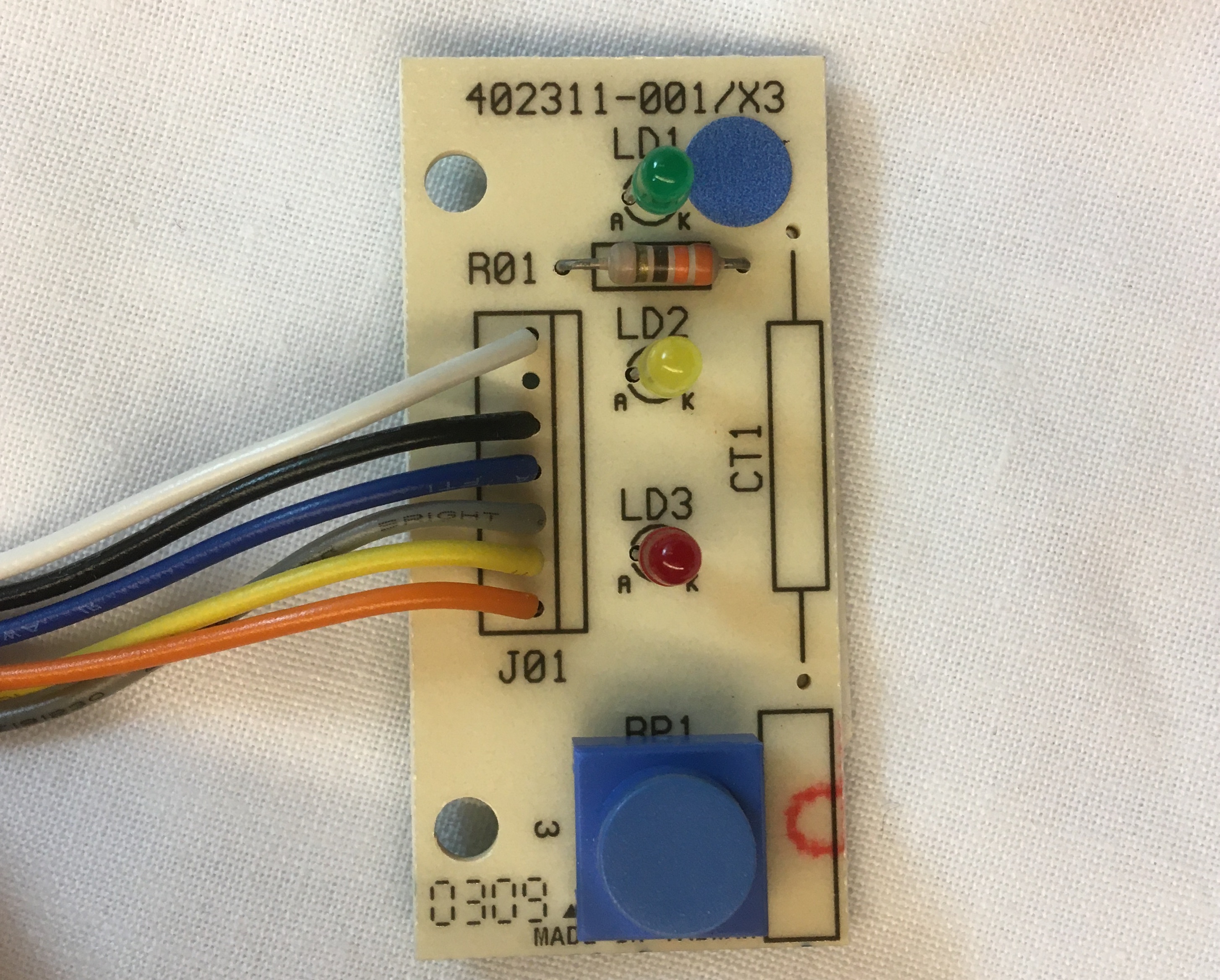 Simple White Backed PCB with THT components and Wires Leading Offboard