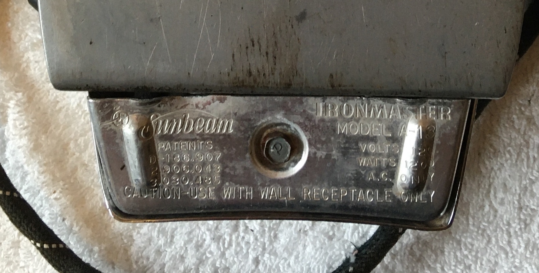 Text Inscribed on Heel Plate on Iron Bottom