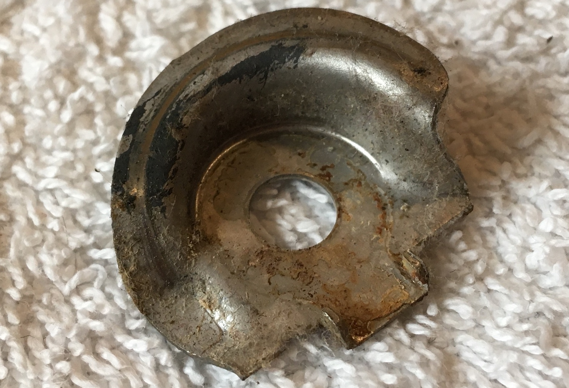 Circular Metal Piece with Ramp Along Rim