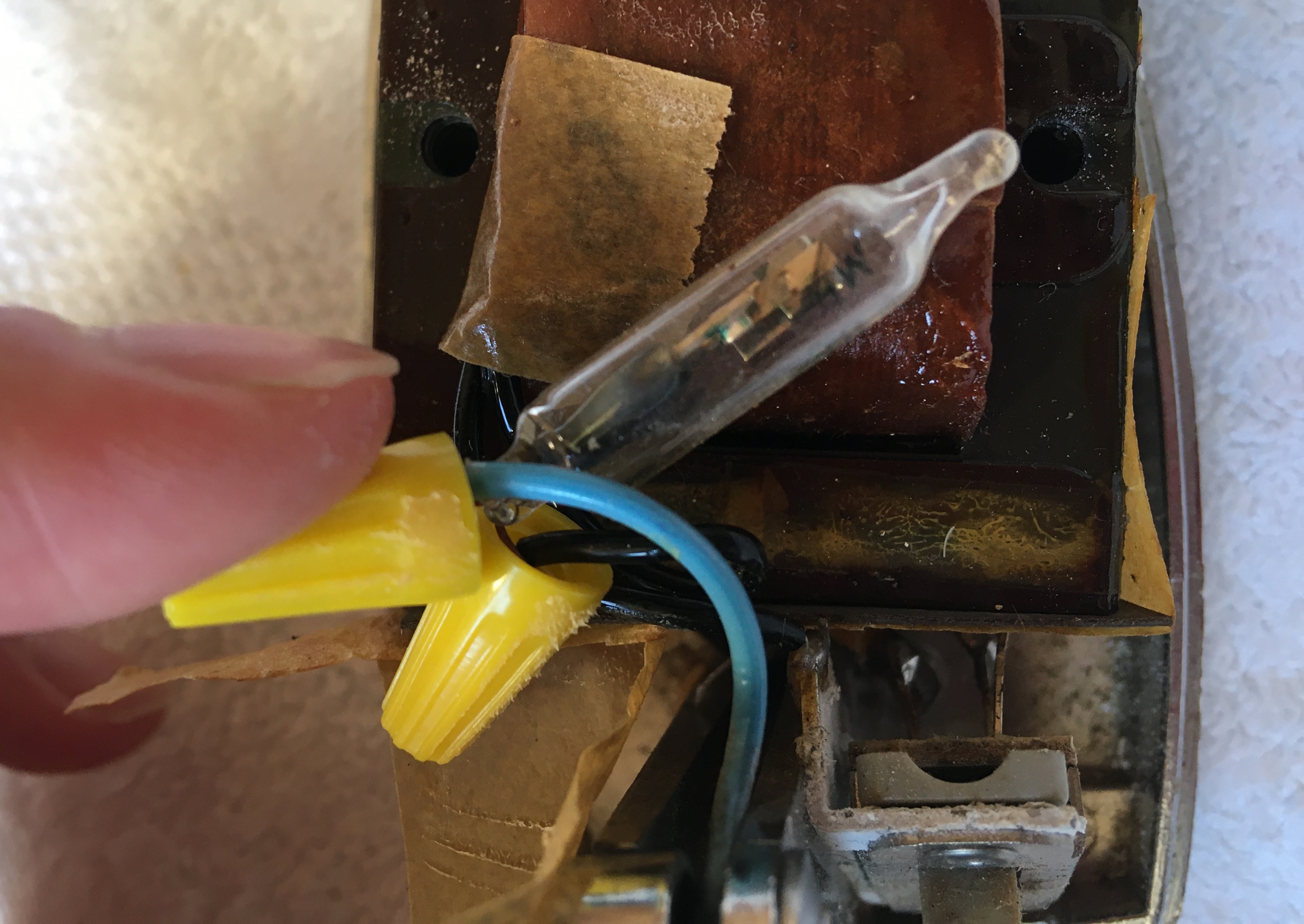 Pair of Yellow Twist-on Wire Connectors Holding Together Fuse Wires