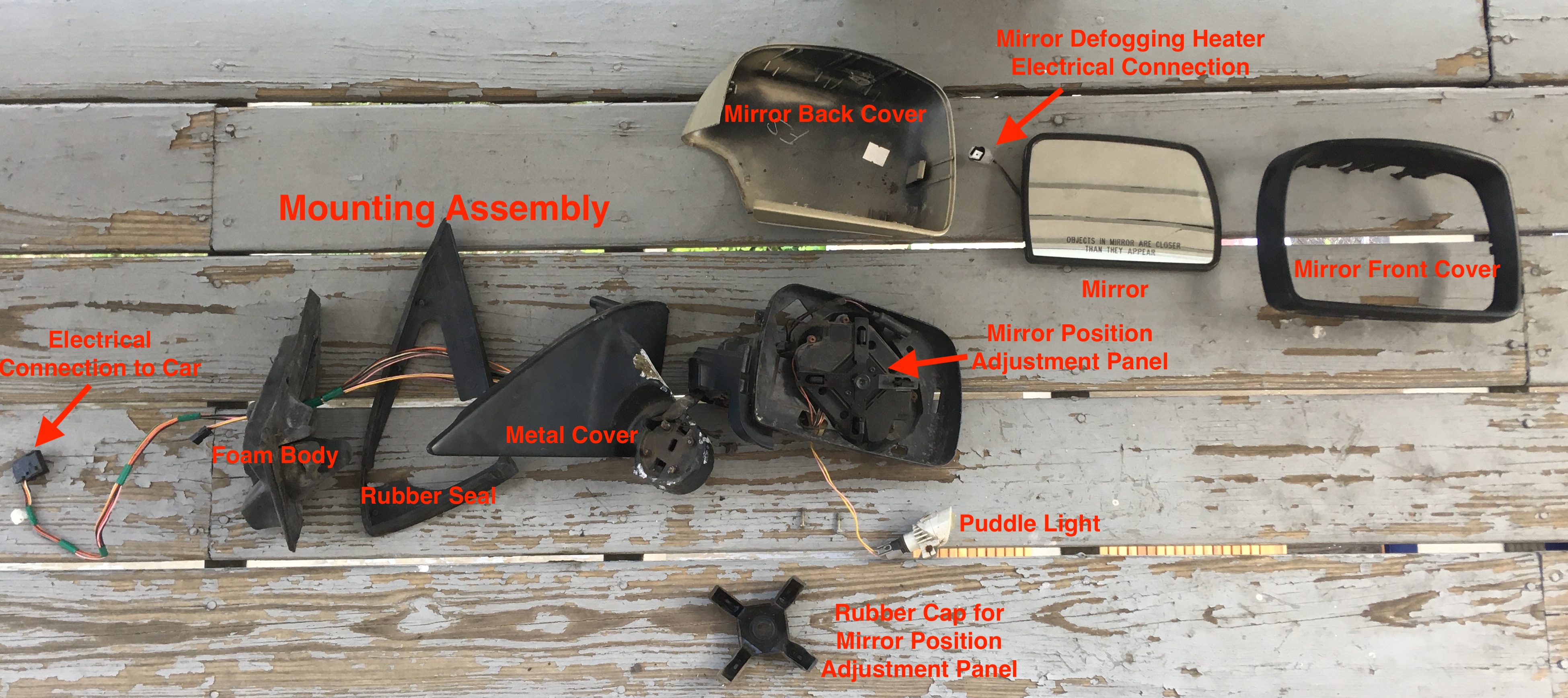 Side View Mirror Components Laid Out on Porch