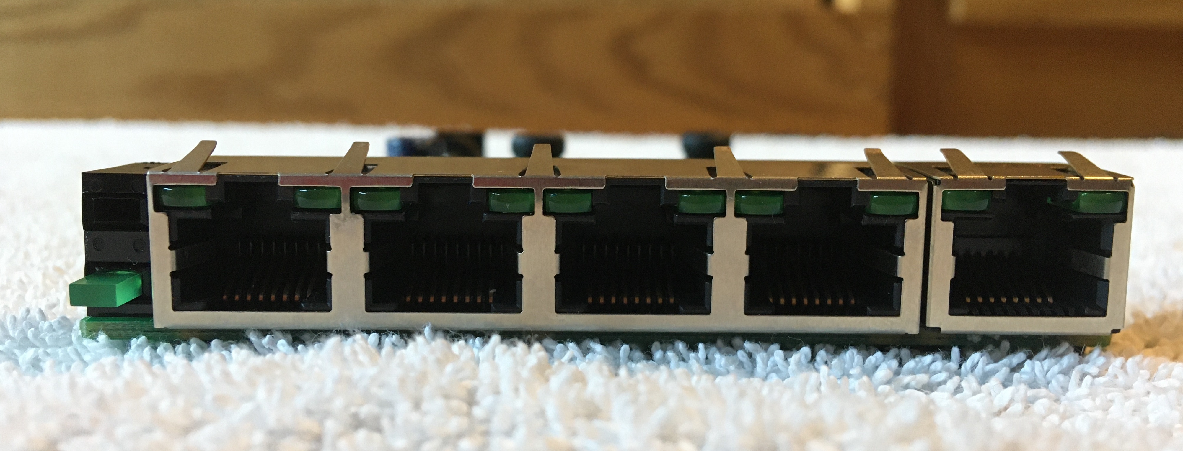 Five Ethernet Ports and Power LED Mounted to PCB